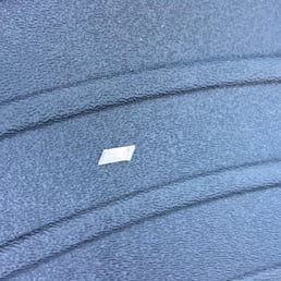 Razor blade tip left in the car after the owner of Tintworks said he uses nothing hard that can scratch the car. Razor blade tip left in the car after the owner of Tintworks said he uses nothing hard that can scratch the car.