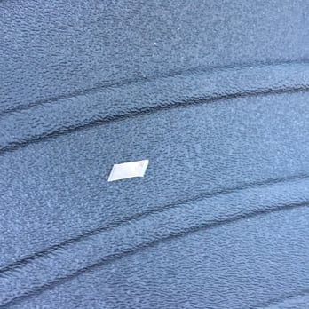 Tintworks - Razor blade tip left in the car after the owner of Tintworks said he uses nothing hard that can scratch the car. - Auto Detailing Near Me - San Jose, California Tintworks - Razor blade tip left in the car after the owner of Tintworks said he uses nothing hard that can scratch the car. - Auto Detailing Near Me - San Jose, California