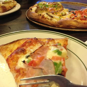 Kristy's Kafe - a slice of pizza on a plate - Pizza Near Me - Anthony, Kansas Kristy's Kafe - a slice of pizza on a plate - Pizza Near Me - Anthony, Kansas