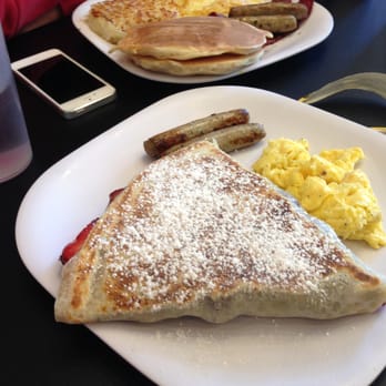Crispy Crêpes Cafe - Strawberries and Nutella Crepe with sides of Sausage and Scrambled Eggs - Creperies Near Me - Boston, Massachusetts