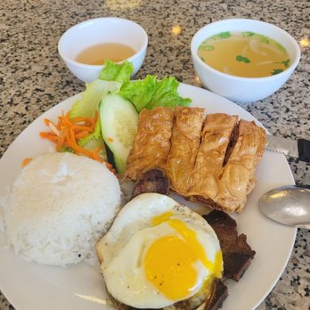 Pho Lee Hoa Phat - Porkchop rice dish with fried egg and a crispy tofu skin wrapped shrimp patty. Comes with side of soup broth. - Vietnamese Near Me - Pleasant Hill, California Pho Lee Hoa Phat - Porkchop rice dish with fried egg and a crispy tofu skin wrapped shrimp patty. Comes with side of soup broth. - Vietnamese Near Me - Pleasant Hill, California