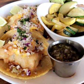 Seis Kitchen - Fish tacos and behind it the nachos grande - Mexican Near Me - Tucson, Arizona Seis Kitchen - Fish tacos and behind it the nachos grande - Mexican Near Me - Tucson, Arizona