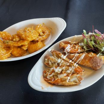 Noir Kitchen & Cocktails - Bang bang shrimp and buffalo Chicago eggrolls - Soul Food Near Me - Nashville, Tennessee Noir Kitchen & Cocktails - Bang bang shrimp and buffalo Chicago eggrolls - Soul Food Near Me - Nashville, Tennessee