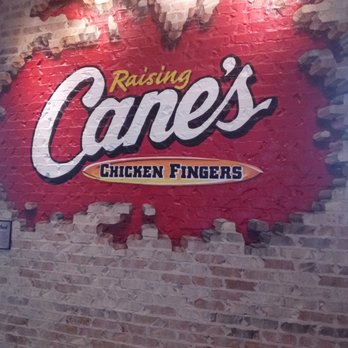 Raising Cane's Chicken Fingers - a brick wall - Fast Food Near Me - Manhattan, Kansas Raising Cane's Chicken Fingers - a brick wall - Fast Food Near Me - Manhattan, Kansas