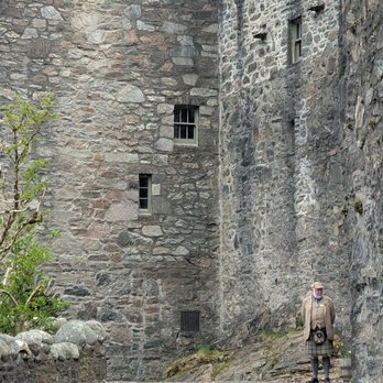 Eilean Donan Castle - The uniforms for the people working the castle so appropriate - Castles Near Me - Kyle, HLD