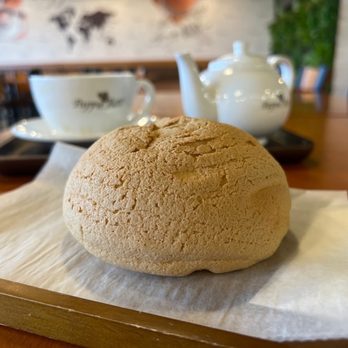 PappaRoti - Naperville - a piece of bread on a napkin - Coffee & Tea Near Me - Naperville, Illinois