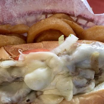 Foster's Grille - Philly Cheesesteak with onion rings - Burgers Near Me - Warrenton, Virginia