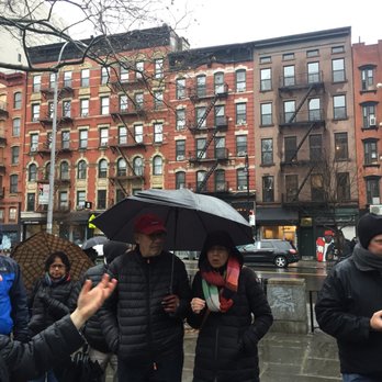 Big Onion Walking Tours - Trying foods in the rain while listening to a story about Eleanor Rosevelt at a park. - Walking Tours Near Me - Brooklyn, New York Big Onion Walking Tours - Trying foods in the rain while listening to a story about Eleanor Rosevelt at a park. - Walking Tours Near Me - Brooklyn, New York