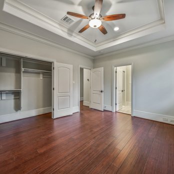Linden Builders - a large empty room with a ceiling fan - General Contractors Near Me - Houston, Texas
