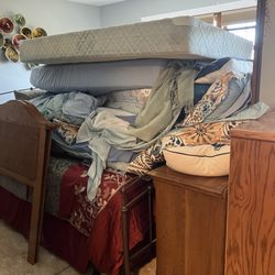 Carpet Factory Outlet - Broke down all the furniture from one bedroom and piled it all on the bed of another bedroom.