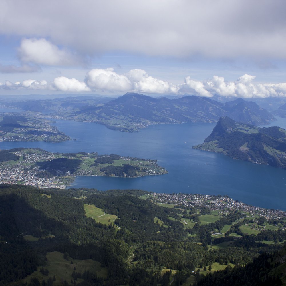 Pilatus Bahnen - Lake Lucerne while riding the bigger gondola to the top. - Train Stations Near Me - Kriens, LU Pilatus Bahnen - Lake Lucerne while riding the bigger gondola to the top. - Train Stations Near Me - Kriens, LU