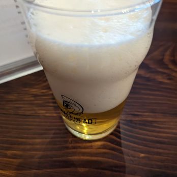 Whalehead Brewery - a glass of beer on a table - Brewpubs Near Me - Corolla, North Carolina