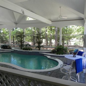 Medhus Construction - a pool in a covered patio - General Contractors Near Me - Gloucester Point, Virginia Medhus Construction - a pool in a covered patio - General Contractors Near Me - Gloucester Point, Virginia