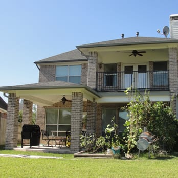 Stonecraft Builders - a large brick house with a balcony - General Contractors Near Me - Houston, Texas Stonecraft Builders - a large brick house with a balcony - General Contractors Near Me - Houston, Texas