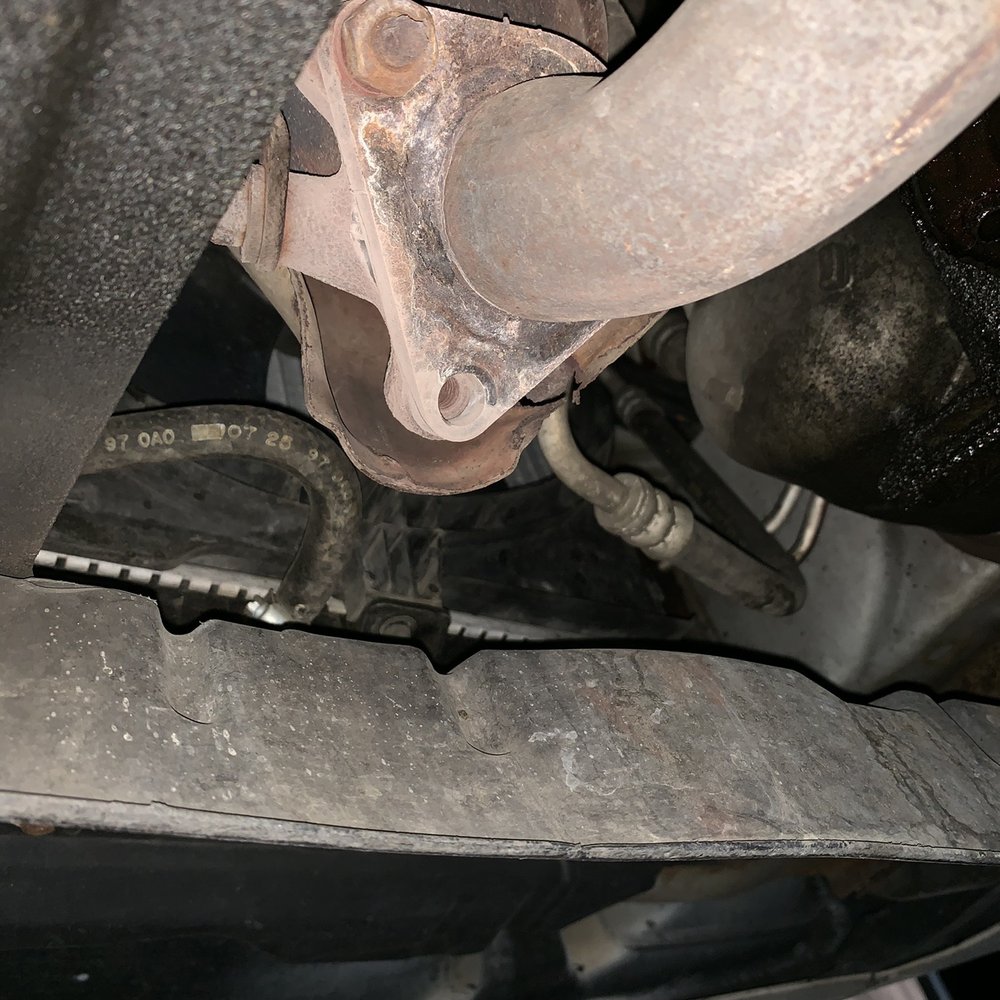 One of the bolts missing. This is the bottom of the catalytic converter attached to the exhaust. Those boys were really bad too! One of the bolts missing. This is the bottom of the catalytic converter attached to the exhaust. Those boys were really bad too!
