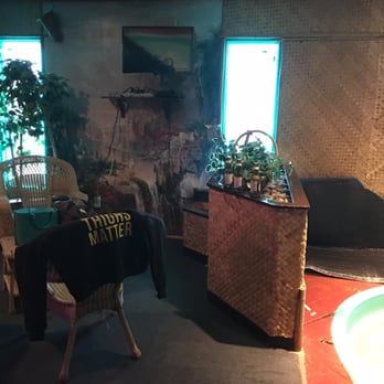 Hot House - Sitting area next to fireplace in Tahiti Room - Saunas Near Me - Lansing, Michigan Hot House - Sitting area next to fireplace in Tahiti Room - Saunas Near Me - Lansing, Michigan