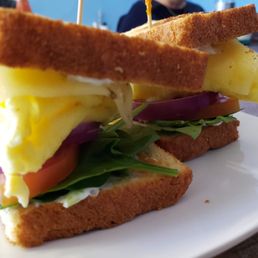 Cali Breakfast Sandwich, on sourdough or a bagel, w/eggs, cheese, bacon, avocado, tomatoes, spinach and sprouts & a flavored cream cheese.