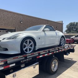Ontrack Assist Towing  - A beautiful white coupe rests on our flatbed