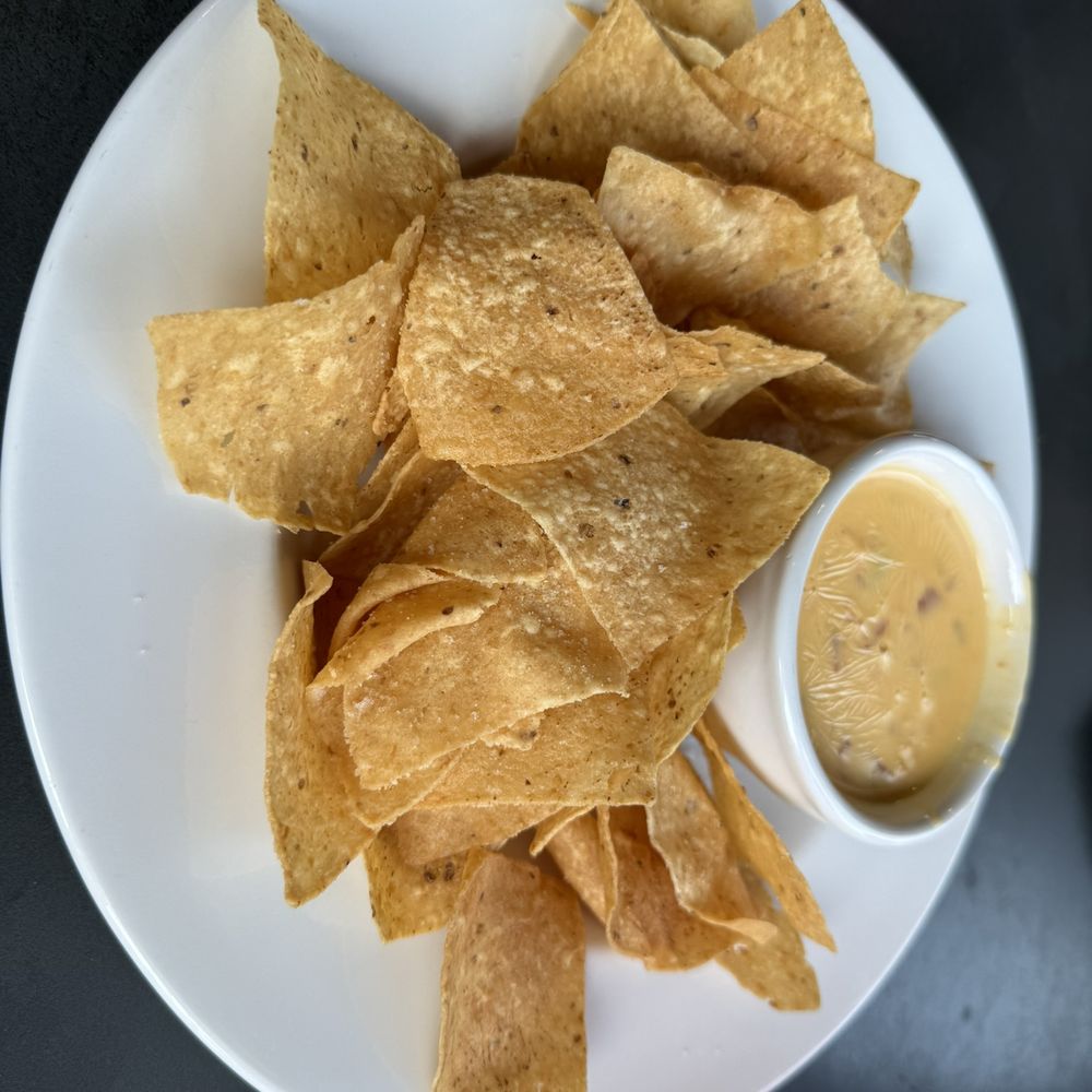 Pluckers Wing Bar - Lakeline - chips and queso - American Near Me - Cedar Park, Texas Pluckers Wing Bar - Lakeline - chips and queso - American Near Me - Cedar Park, Texas