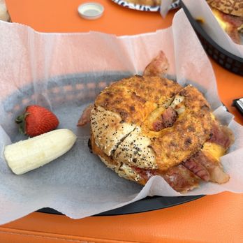 Paradise Bagels Cafe - a bagel and a strawberry - New American Near Me - Holmes Beach, Florida