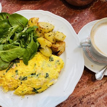 Sant Ambroeus Madison - Three egg omelette with spinach, fresh mozzarella and ham with my cappuccino on the right - Italian Near Me - New York, New York Sant Ambroeus Madison - Three egg omelette with spinach, fresh mozzarella and ham with my cappuccino on the right - Italian Near Me - New York, New York