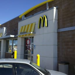 a car parked in front of a mcdonald's