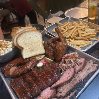 Holé Smokes - Try It All Serves 4. 1/2 brisket, 1/2 ribs, 1/3 pulled pork, 1/4 tri tip, 1/2 chicken, 2 links, 1/4 shrimp, 3 16oz sides. - Barbeque Near Me - Costa Mesa, California Holé Smokes - Try It All Serves 4. 1/2 brisket, 1/2 ribs, 1/3 pulled pork, 1/4 tri tip, 1/2 chicken, 2 links, 1/4 shrimp, 3 16oz sides. - Barbeque Near Me - Costa Mesa, California