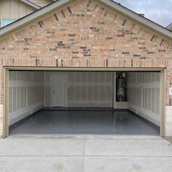Next Level Epoxy Flooring and Concrete Staining - a garage in a residential area - Flooring Near Me