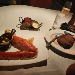 Flame Steakhouse - Crab leg, lyonaise potatoes, Ribeye, brandy mushrooms