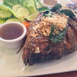 Whole fried tilapia with a yummy sweet sauce and a slightly spicy sauce