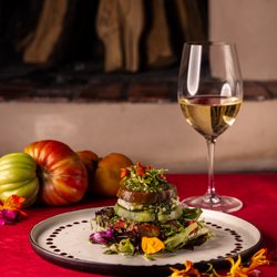 The Pink Adobe - This is our Heirloom Tomato Salad, with basil pesto, goat cheese mousse balsamic glaze. This dish has us very excited for summer and our vis