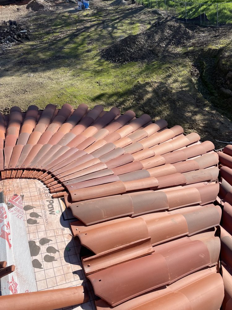 Slide of Nick’s Roofing