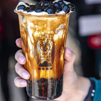 Tiger Sugar - a hand holding a cup of iced coffee - Bubble Tea Near Me - Philadelphia, Pennsylvania