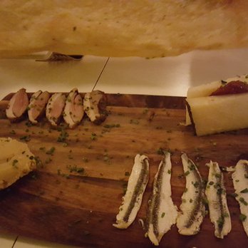 Side Work - Board with Duck Pastrami, Boquerones, Chipotle hummus and Manchego Cheese with quince paste.  Served with Lavash crackers - American Near Me - Telluride, Colorado