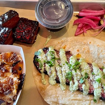 Interstellar BBQ - Peach glazed pork belly, brisket taco and scalloped potatoes. 10/10 would recommend! - Barbeque Near Me - Austin, Texas
