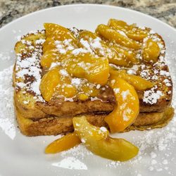 Cafe On Liberty - French toast stuffed with cream cheese and covered with peaches