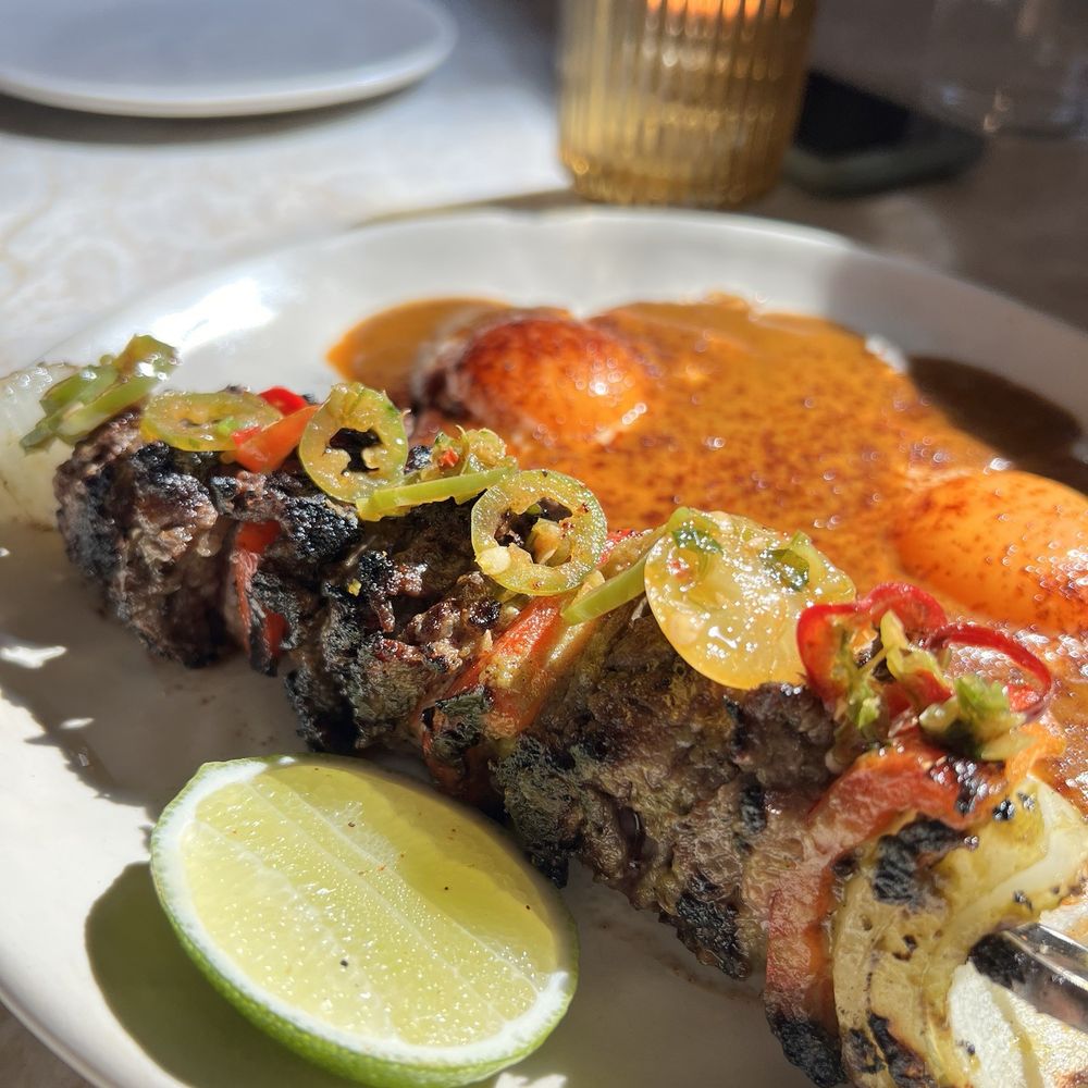 Este - Alambre & eggs are Steak & eggs, our most loved dish.  Steak on skewer was so tender & juicy! - Seafood Near Me - Austin, Texas
