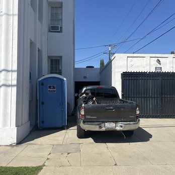Essential Management - A portable toilet right outside of someone's living room and bedroom which has now been there for months - Property Management Near Me - Los Angeles, California