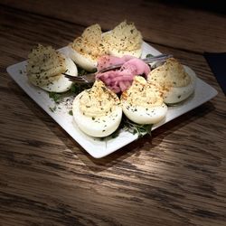 4 Partners In Crime - Bloody Mary Crab Deviled Eggs  Deviled eggs filled with blue and snow crab, shallots, mayo, dijon, and Old Bay seasoning