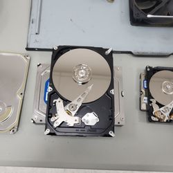 The Little Guy Computer Consultants & Repair - What the inside of a hard drive looks like.