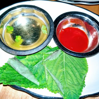 Mott St - Sambo chili sauce, scallion vinegar & sesame leaves for black bass wraps - Asian Fusion Near Me - Chicago, Illinois