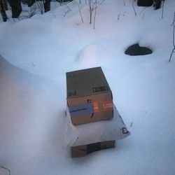 US Post Office - Packages left in the snow and rain
