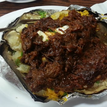 Kelley's Country Cookin' - Good lord that's a big potato. I couldn't finish 1/4 of it. BBQ beef is lean too. - American Near Me - Alvin, Texas Kelley's Country Cookin' - Good lord that's a big potato. I couldn't finish 1/4 of it. BBQ beef is lean too. - American Near Me - Alvin, Texas