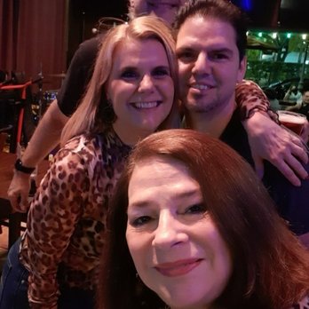 Sunset Tavern - Tony Sue AND Drew of the Exit Left Band on break AT Sunset Tavern for a photo with super fun EL fan Maria Elena - Sports Bars Near Me - South Miami, Florida Sunset Tavern - Tony Sue AND Drew of the Exit Left Band on break AT Sunset Tavern for a photo with super fun EL fan Maria Elena - Sports Bars Near Me - South Miami, Florida