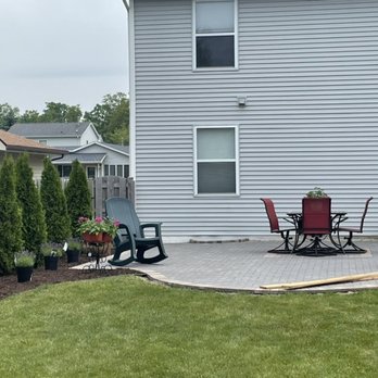 Lionel & Aurelio Landscape - a patio with chairs and a fire pit - Landscaping Near Me Lionel & Aurelio Landscape - a patio with chairs and a fire pit - Landscaping Near Me