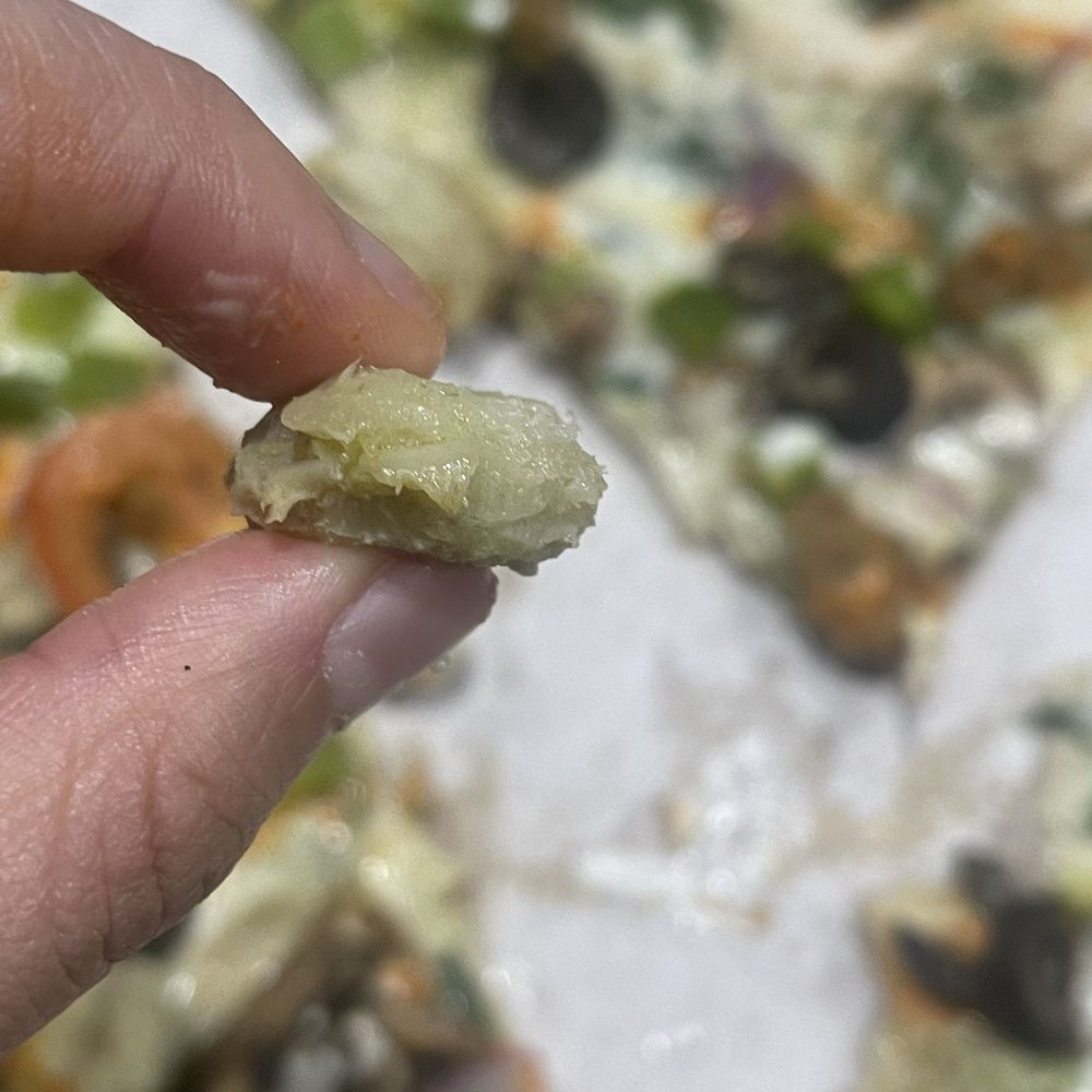 MOD Pizza - a hand holding a piece of pizza - Fast Food Near Me - Tracy, California MOD Pizza - a hand holding a piece of pizza - Fast Food Near Me - Tracy, California