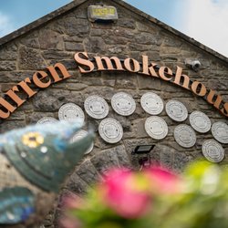 Burren Smokehouse - The outside of the Burren Smokehouse visitor centre and salmon mosaic sculpture