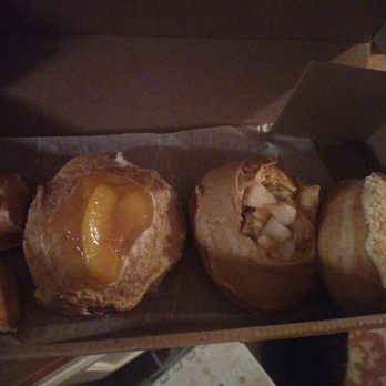 Jeff’s Donuts - My photography skills stink, but the specialty donuts are amazing. This is peaches and cream and caramel apple. Big yum. - Desserts Near Me - Louisville, Kentucky
