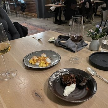 Broadcloth - a plate of food and a glass of wine - New American Near Me - Charlottesville, Virginia