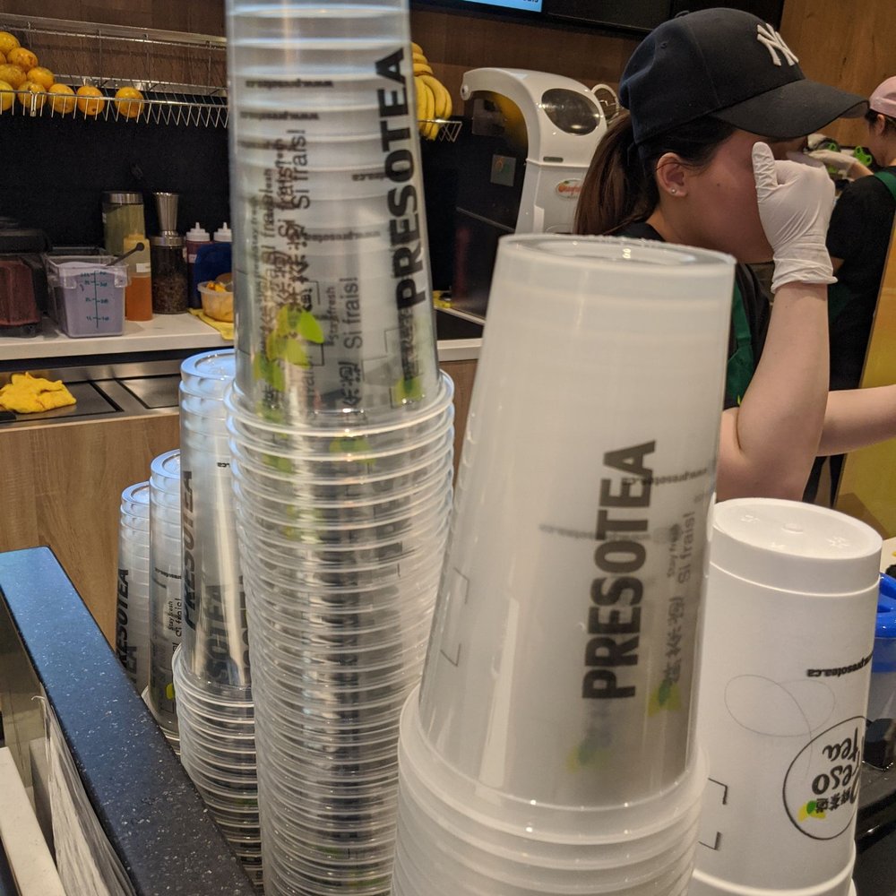 Freshly Squeezed - Regular sized cups at the back, large sizes cups in the foreground - Juice Bars & Smoothies Near Me - Etobicoke, Ontario